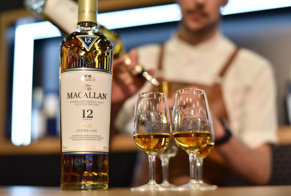 LONDON, ENGLAND - OCTOBER 23: A bar tender pours 12 years old Macallan highland single malt scotch whisky during the RM Sotherb's London, European car collectors event at Olympia London on October 23, 2019 in London, England. RM Sotheby's London, billed as the annual highlight for European car collectors will show Edwardians to modern supercars and offers collectors and attendees the opportunity to experience the very best of European cars. Sotheby’s will also present The Ultimate Whisky Collection, the most valuable collection of whisky ever to be sold at auction, both events will culminate in live auctions on 24th October.  (Photo by John Keeble/Getty Images)