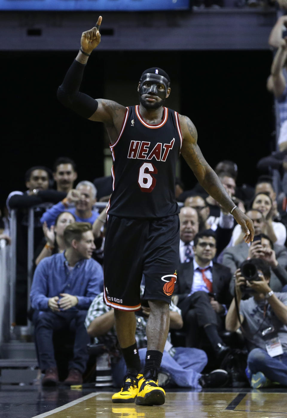 Miami Heat small forward LeBron James (6) celebrates after scoring against the New York Knicks during the second half of an NBA basketball game in Miami, Thursday, Feb. 27, 2014. Miami won 108-82. (AP Photo/Alan Diaz)