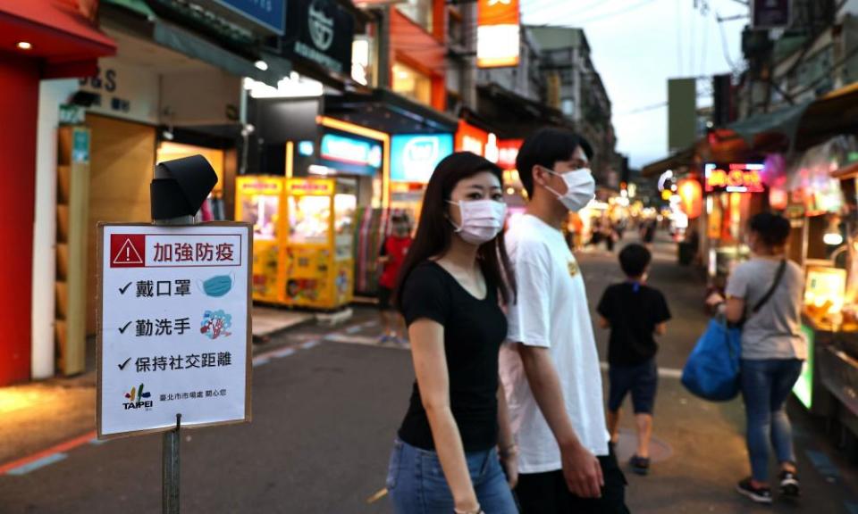 People at a night market in Taipei