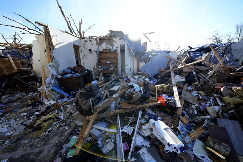 Damage to the house of Lonnie and Melissa Pierce, who were killed when a truck landed on their house during a tornado that hit three days earlier, Monday, March 27, 2023, in Rolling Fork, Miss. (AP Photo/Julio Cortez)