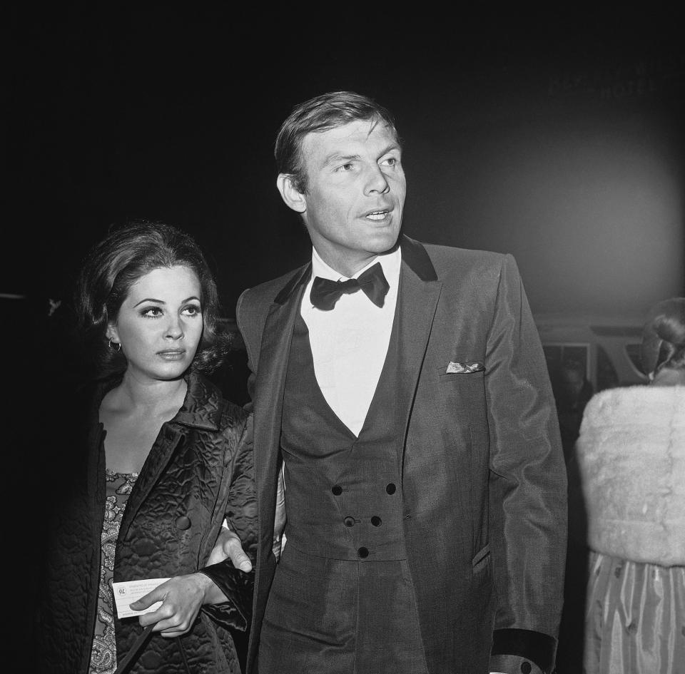 Adam West and Barbara Parkins arrive for a premiere, 1966