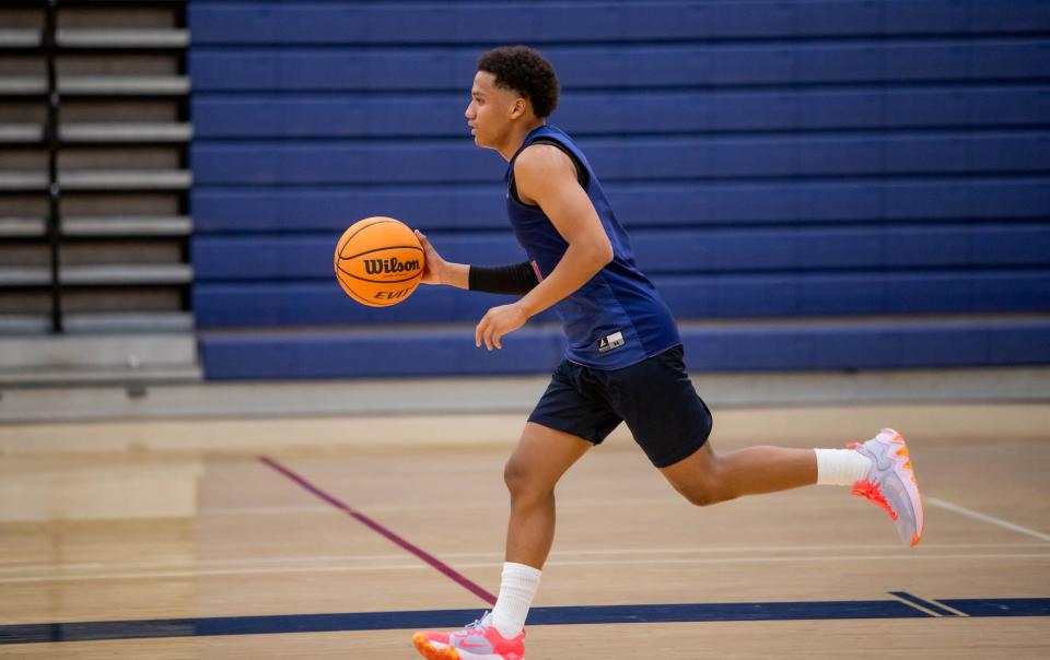 Perry Pumas NoNo Brown runs with the ball during basketball practice at Perry High School's gym in Gilbert on Nov. 7, 2023.