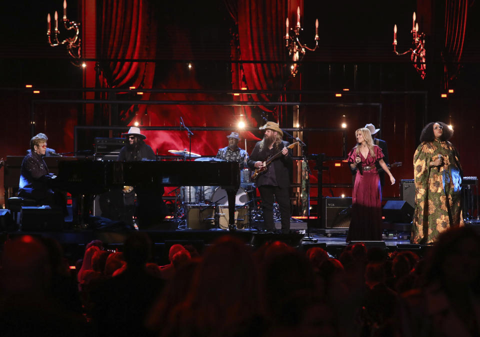 Elton John, from left, Chris Stapleton, Sheryl Crow, and Brittany Howard perform a tribute to Robbie Robertson during the in memoriam segment of the Rock & Roll Hall of Fame Induction Ceremony on Friday, Nov. 3, 2023, at Barclays Center in New York. (Photo by Andy Kropa/Invision/AP)