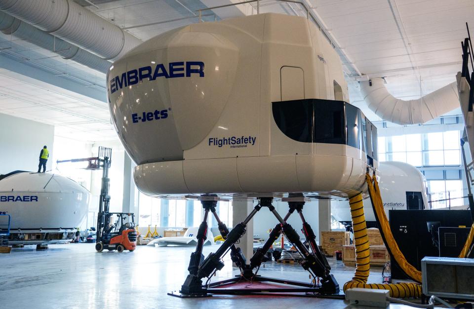 A pilot trains inside a FlightSafety International Embraer 170 flight simulator on Republic Airways' Aviation Campus in Carmel. The company will construct eight simulators in the training center, each taking five weeks to assemble. Each simulator has a corresponding debriefing room to discuss each flight simulation. 