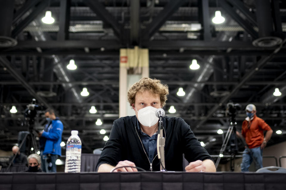 Garrett Dietz, Philadelphia supervisor of elections, reports the election results to the Philadelphia city commissioners while formally announcing the results of the computation of the ballots for the general election, at the Pennsylvania Convention Center, Tuesday, Nov. 17, 2020, in Philadelphia. (AP Photo/Laurence Kesterson)