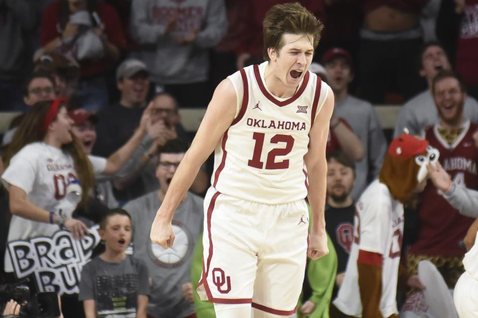 Oklahoma guard Austin Reaves celebrates after dunking the ball.