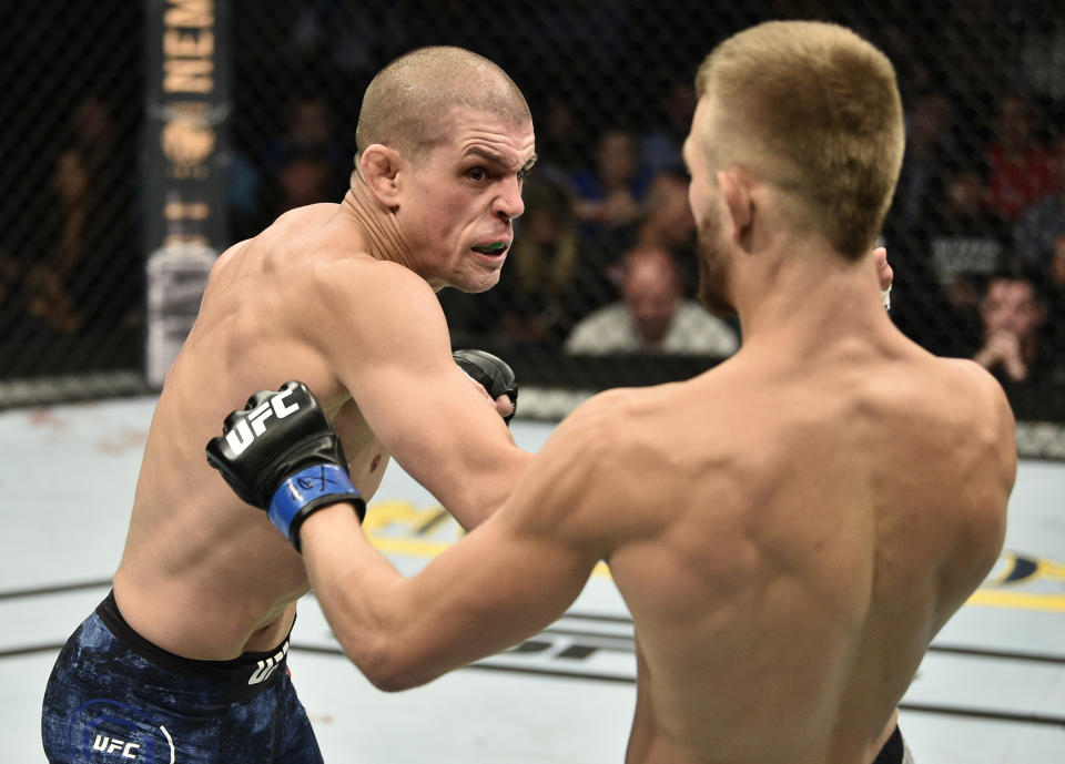 BOSTON, MASSACHUSETTS - OCTOBER 18:  (L-R) Joe Lauzon punches Jonathan Pearce in their lightweight bout during the UFC Fight Night event at TD Garden on October 18, 2019 in Boston, Massachusetts. (Photo by Chris Unger/Zuffa LLC via Getty Images)