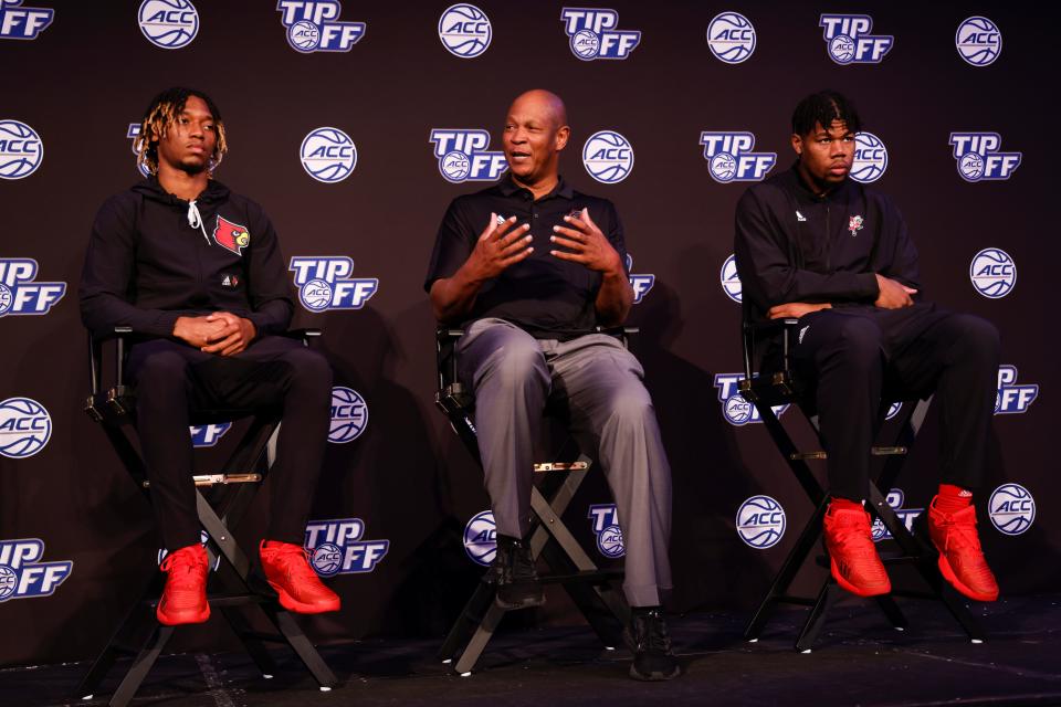 From left, Louisville guard El Ellis, coach Kenny Payne and center Sydney Curry sit on stage at ACC Tipoff Wednesday in Charlotte, N.C.