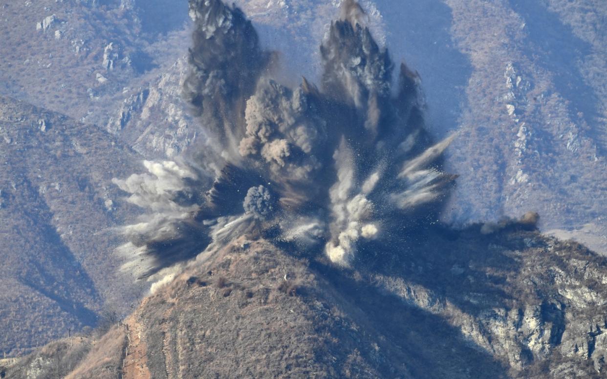 A North Korea's guard post in the demilitarized zone is blown up in this picture taken from South Korea's territory - REUTERS