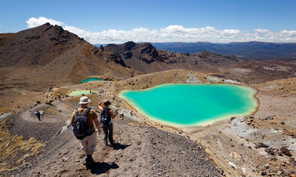 Walkers and Emerald Lakes on the Tongariro Alpine Crossing, Tongariro National Park, UNESCO Site, North Island, New Zealand.