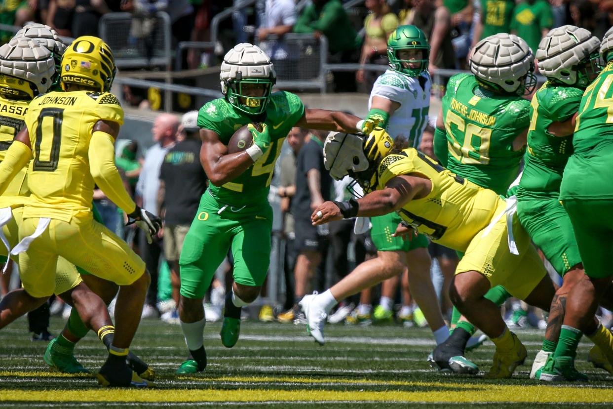 Green Team running back Dante Dowdell carries the ball as the Oregon Ducks host their annual spring game at Autzen Stadium Saturday, April 29, 2023, in Eugene, Ore. 