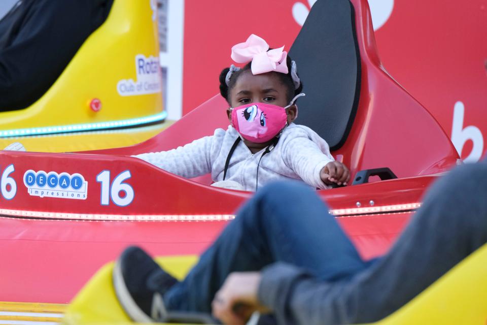 The UC Health Ice Rink at Fountain Square opens for the season Saturday. The rink features bumper cars on weekends. Pictured: Olanna Donaldson, 5, rides in a bumper car at UC Health Ice Rink at Fountain Square in 2020.