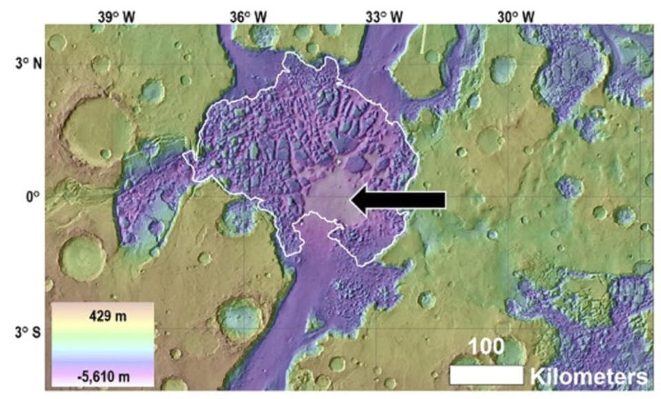 A satellite view of view of Hydraotes Chaos (white outline), including the location of the proposed mud lake (black arrow).