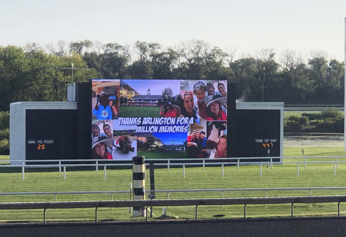 A message reading, “Thanks Arlington for a Million Memories” plays on the infield video screen at Arlington Park in Arlington Heights, Ill., between races on Saturday, Sept. 18, 2021. The racetrack is expected to close after the completion of racing on Sept. 25, with ownership taking bids for the future of the land. (AP Photo/Steve Whyno)