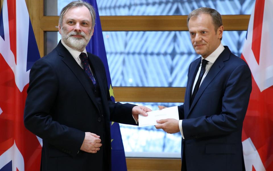 British Ambassador to the EU Tim Barrow hands the Brexit letter to European Council President Donald Tusk in Brussels - Credit: Xinhua / Barcroft Images/Xinhua / Barcroft Images