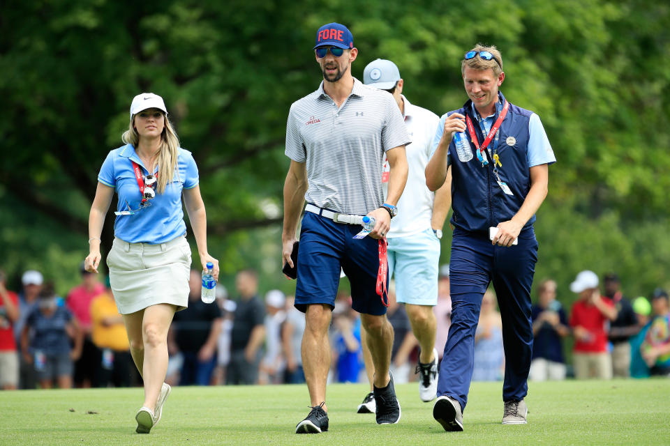 Michael Phelps followed Tiger Woods Sunday at the PGA Championship. (Getty Images)