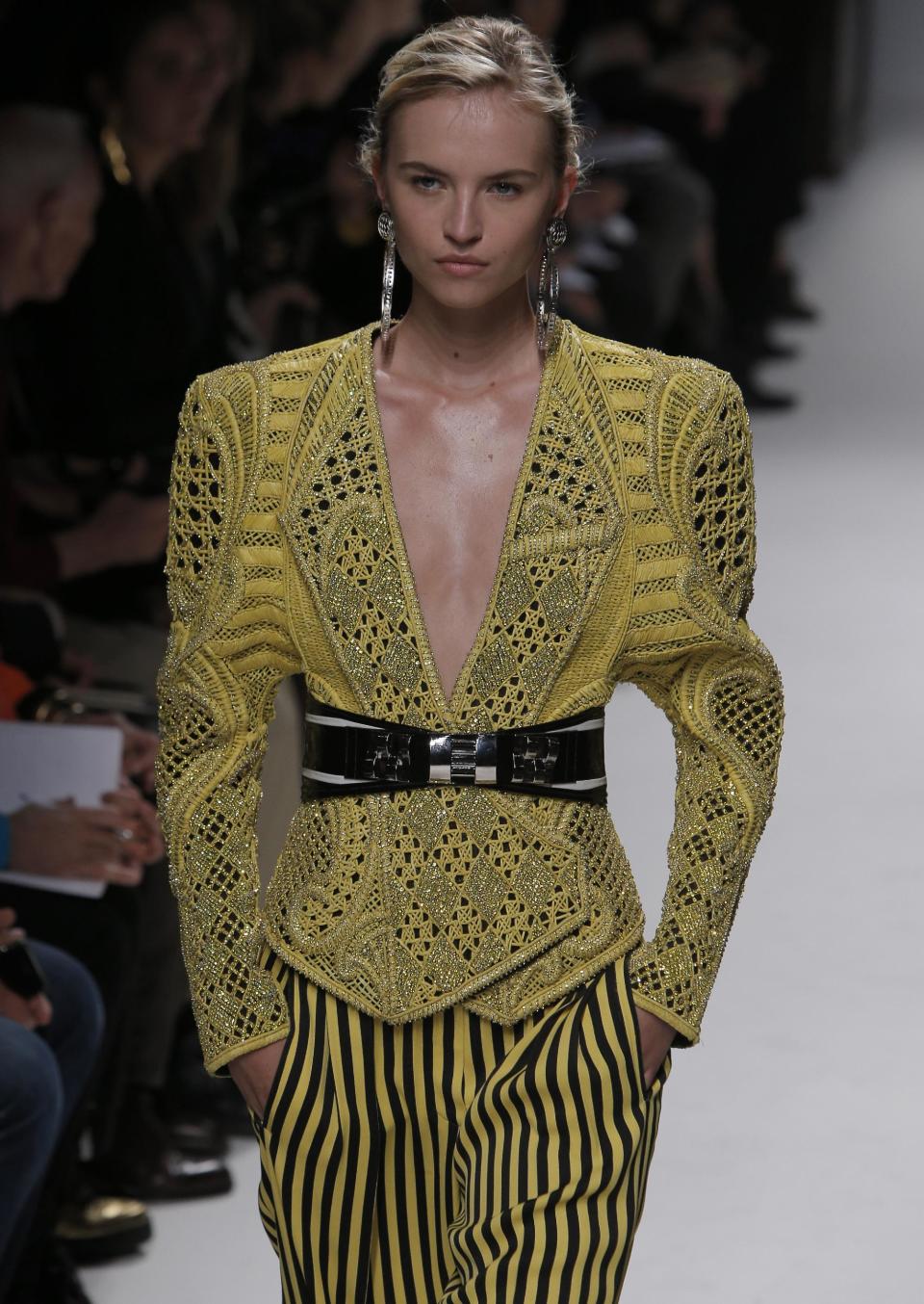 A model wears a creation by French designer Olivier Rousteing for Balmain's spring-summer 2013 ready to wear collection in Paris, Thursday, Sept. 27, 2012. (AP Photo/Francois Mori)