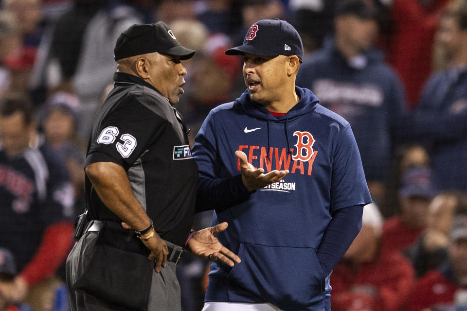 BOSTON, MA - OCTOBER 19: Manager Alex Cora of the Boston Red Sox argues with umpire Laz Diaz after he is called out on strikes during the third inning of game four of the 2021 American League Championship Series against the Houston Astros at Fenway Park on October 19, 2021 in Boston, Massachusetts. (Photo by Billie Weiss/Boston Red Sox/Getty Images)