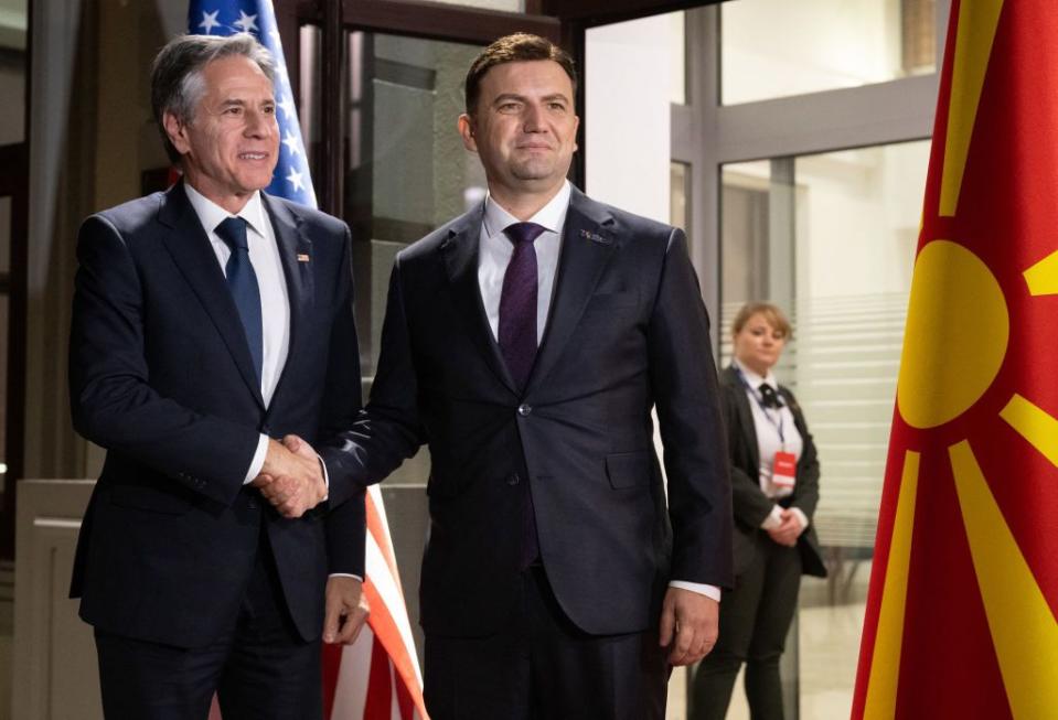 North Macedonia Foreign Minister Bujar Osmani (R) greets U.S. Secretary of State Antony Blinken as he arrives for an OSCE meeting in Skopje, North Macedonia, on Nov. 29, 2023. (Saul Loeb/POOL/AFP via Getty Images)