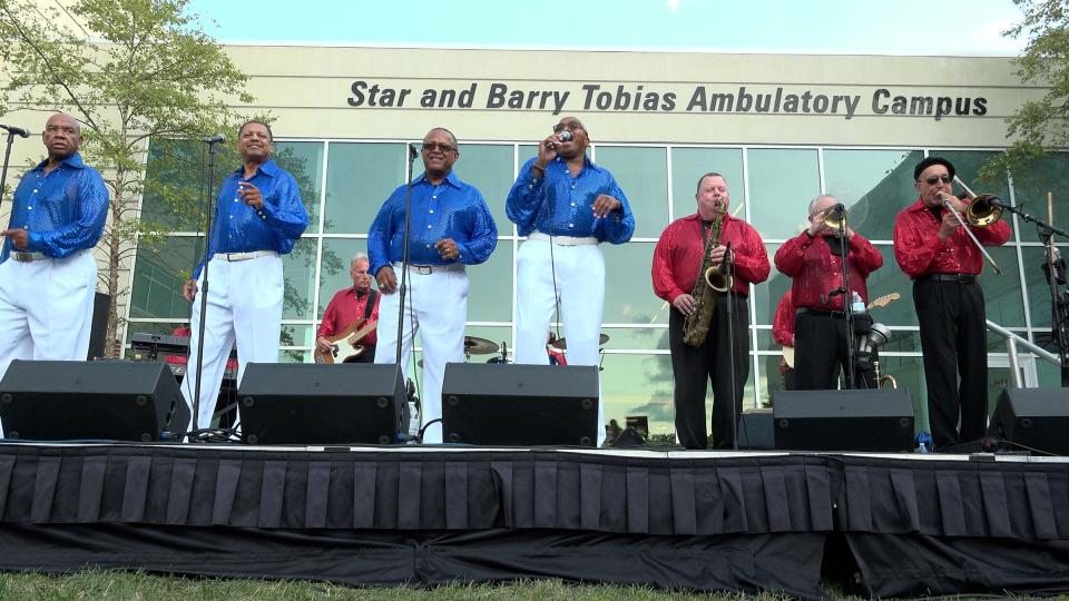 Steve Barlotta performs on the saxophone with his band Sensational Soul Cruisers outside CentraState's Star and Barry Tobias Ambulatory Campus in Freehold Township Wednesday evening, September 14, 2022. Barlotta credits hospital staff for saving his life in 2020, when he was on a ventilator for 24 days and later had to relearn how to move again.