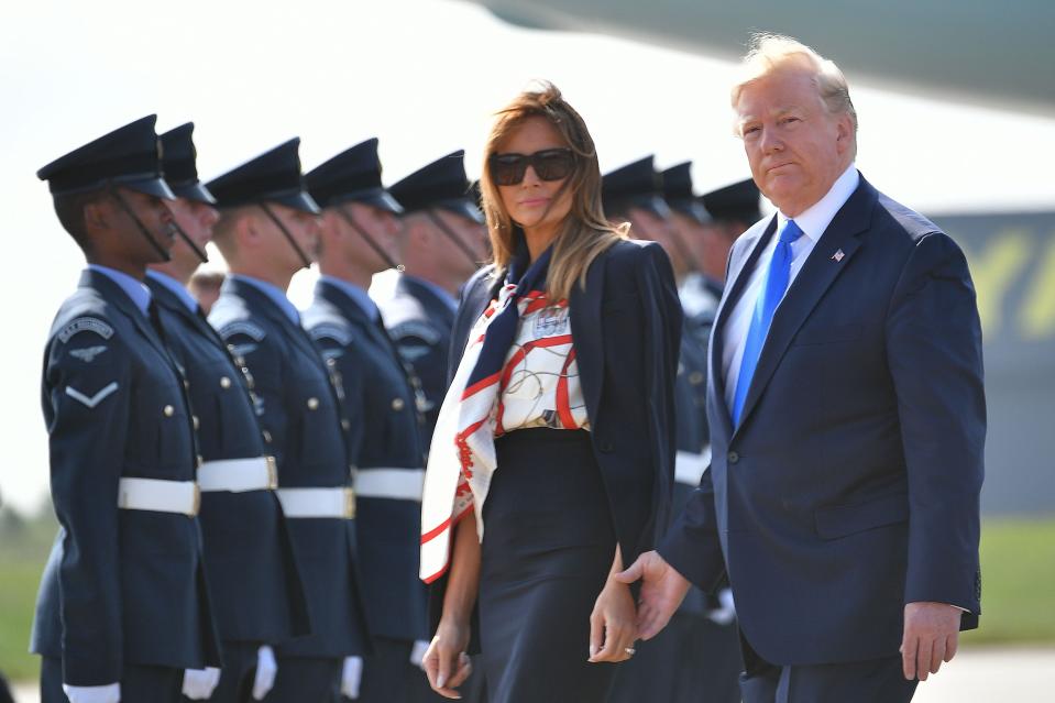 President Donald Trump and first lady Melania Trump walk to the Marine One helicopter after disembarking Air Force One at Stansted Airport, north of London on June 3, 2019, as they begin a three-day State Visit to the UK.