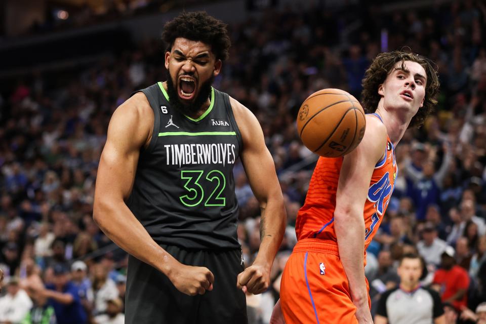 Timberwolves center Karl-Anthony Towns (32) celebrates after a basket next to Thunder guard Josh Giddey in the third quarter Friday night at Target Center in Minneapolis.