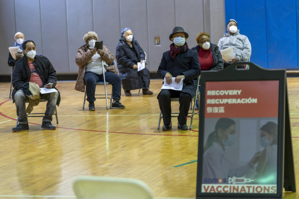 Seniors wait to be to register for the first dose of the coronavirus vaccine at a pop-up COVID-19 vaccination site at the Bronx River Community Center, Sunday, Jan. 31, 2021, in the Bronx borough of New York. (AP Photo/Mary Altaffer)