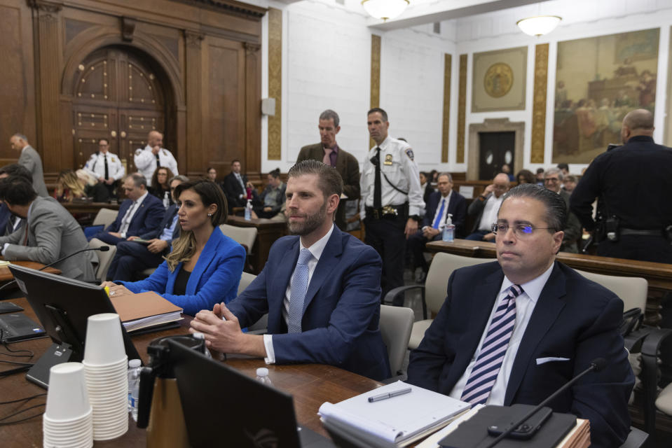 Eric Trump, center, appears at the fraud trial for his father, former President Donald Trump, at New York Supreme Court, Thursday, Nov. 2, 2023. (Jeenah Moon/Pool Photo via AP)