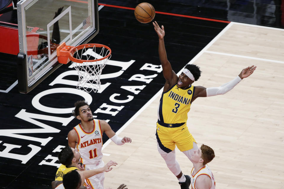 Indiana Pacers guard Aaron Holiday (3) shoots against the Atlanta Hawks during the fourth quarter of an NBA basketball game Saturday, Feb. 13, 2021, in Atlanta. (AP Photo/Butch Dill)