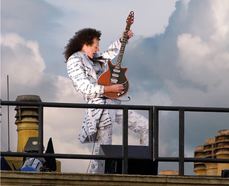 Brian May plays on the rooftop at Buckingham Palace during Queen Elizabeth's Golden Jubilee concert in London