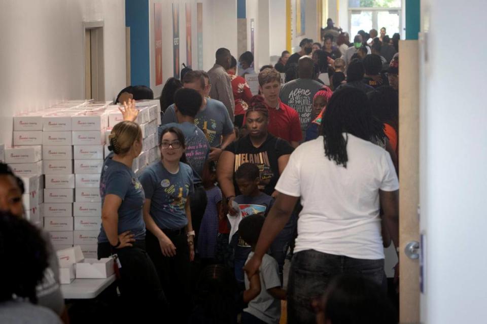 Parents, teachers and students fill the hallways at Rocketship Dennis Dunkins Elementary in Fort Worth, Texas, on Saturday, Aug. 6, 2022. The new charter school opened its doors to parents and students the weekend before school began Monday.