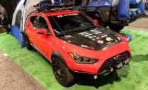 <p>You're unlikely to see a Hyundai Veloster on an off-road trail, let alone a dirt road, but this overland concept is out to change that. The <a href="https://www.caranddriver.com/news/a29492452/hyundai-veloster-off-road-grappler-concept-sema/" rel="nofollow noopener" target="_blank" data-ylk="slk:Veloster Grappler concept;elm:context_link;itc:0;sec:content-canvas" class="link ">Veloster Grappler concept</a> is equipped with typical in-car camping accessories like a rear-hatch tent, solar panels, LED light bars, big all-terrain tires, and a roof basket to carry a spare. It's still pretty low to the ground, and the tire clearance isn't ideal for crawling, but it's a concept. We'd pitch a tent with this thing. </p>
