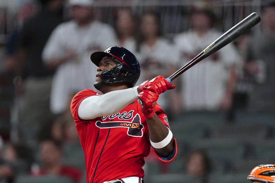 Atlanta Braves' Jorge Soler watches his three-run home run during the eighth inning of the team's baseball game against the San Francisco Giants on Friday, Aug. 27, 2021, in Atlanta. (AP Photo/John Bazemore)