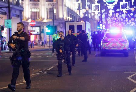 Armed police walk along Oxford Street, London, Britain November 24, 2017. REUTERS/Peter Nicholls