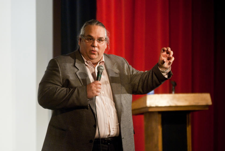 FILE - In this March 3, 2010 file photo, the Rev. Carl Keyes speaks to an audience in Harrisonburg, Va. about his life experiences relating to his organization, Aid for the World. On Wednesday, May 14, 2014, Keyes and his wife, Donna, two New York City ministers who were the subject of an Associated Press expose, have agreed to pay $1.2 million to resolve allegations that they used congregation funds to enrich themselves and buy a luxury home. (AP Photo/Ryan Freeland)