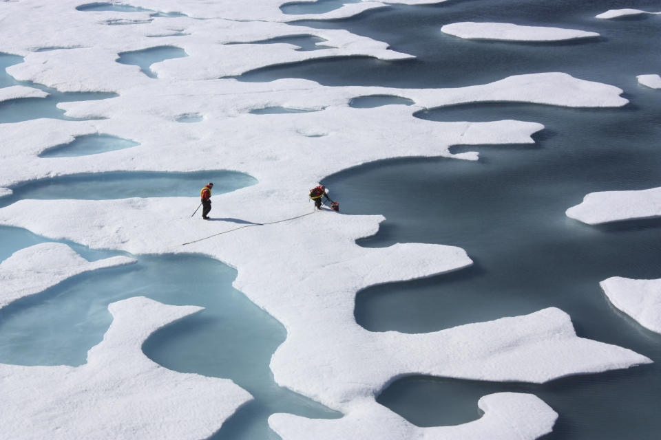 The crew of the U.S. Coast Guard Cutter Healy, in the midst of their ICESCAPE mission, retrieves supplies dropped by parachute in the Arctic Ocean