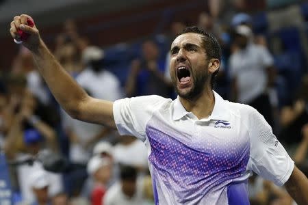 Marin Cilic of Croatia celebrates after defeating Jo-Wilfried Tsonga of France in five sets during their quarterfinals match at the U.S. Open Championships tennis tournament in New York, September 8, 2015. REUTERS/Mike Segar