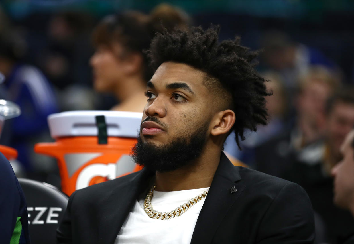 Karl-Anthony Towns of the Minnesota Timberwolves watches his team play against the Golden State Warriors.