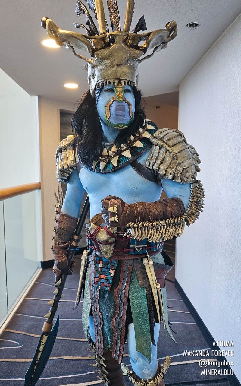 An Attuma cosplayer stands in the hallway.