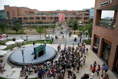 Visitors are seen at a shopping mall near the demilitarized zone separating the two Koreas in Paju, South Korea, July 16, 2017. REUTERS/Kim Hong-Ji