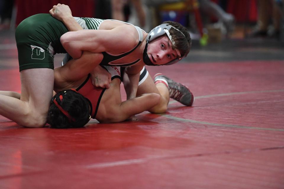 Simon Ruiz of Delbarton wrestles Justin Carro of Morris Hills in a 132-pound match on the first day of the Morris County Tournament at Mount Olive High School on Friday, January 31, 2020.