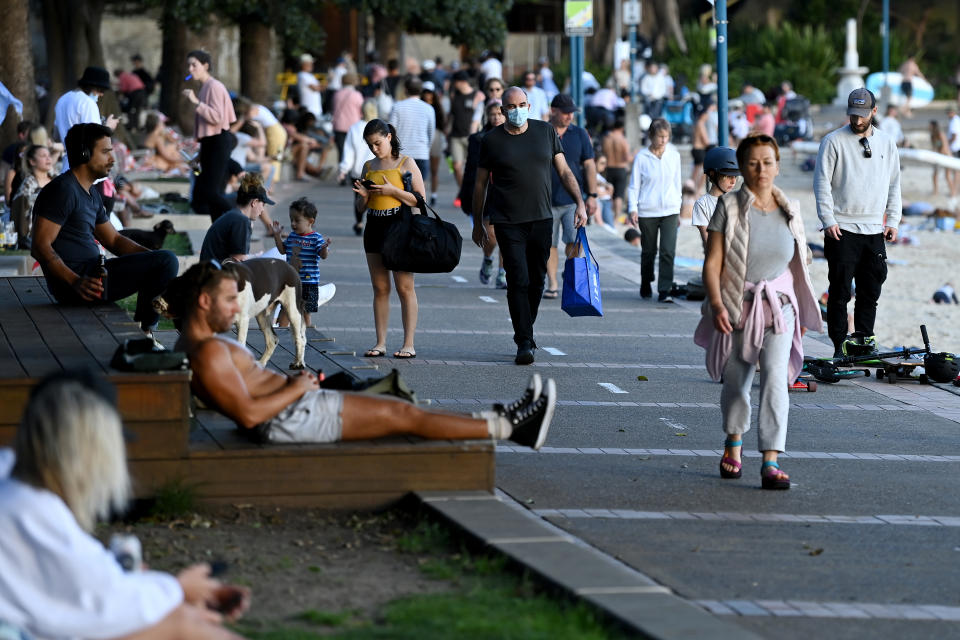 Members of the public exercise along Little Manly Beach in Sydney, Sunday. Source: AAP