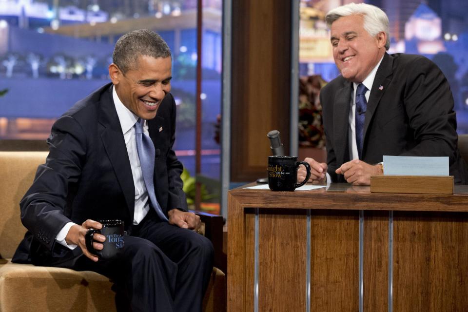 President Barack Obama, left, smiles as he talks with Jay Leno during a commercial break during the taping of his appearance on “The Tonight Show with Jay Leno” in Los Angeles, Tuesday, Aug. 6, 2013. (AP Photo/Jacquelyn Martin)