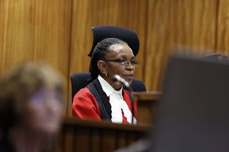 Judge Thokozile Masipa delivers her verdict in the trial of Olympic and Paralympic track star Oscar Pistorius (unseen) at the North Gauteng High Court in Pretoria September 12, 2014. REUTERS/Alon Skuy/Pool