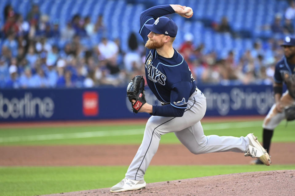 Tampa Bay Rays starting pitcher Drew Rasmussen throws to a Toronto Blue Jays batter during the first inning of the second baseball game of a doubleheader Saturday, July 2, 2022, in Toronto. (Jon Blacker/The Canadian Press via AP)