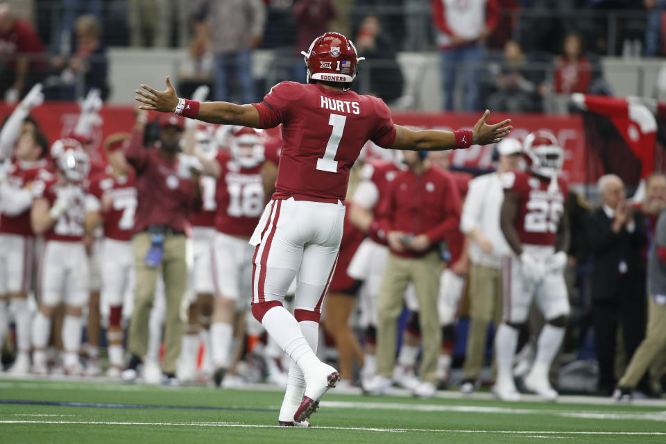 Dec 7, 2019; Arlington, TX, USA; Oklahoma Sooners quarterback Jalen Hurts (1) reacts to a touchdown in the first quarter against the Baylor Bears in the 2019 Big 12 Championship Game at AT&T Stadium. Mandatory Credit: Tim Heitman-USA TODAY Sports