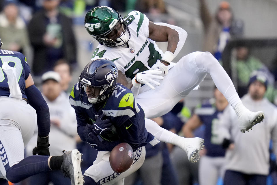 Seattle Seahawks safety Johnathan Abram (23) breaks up a pass intended for New York Jets wide receiver Corey Davis (84) during the second half of an NFL football game, Sunday, Jan. 1, 2023, in Seattle. (AP Photo/Godofredo A. Vásquez)