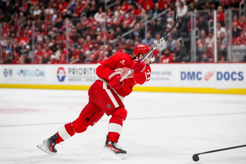 Detroit Red Wings center Dylan Larkin (71) shoots the puck against Montreal Canadiens during the third period at Little Caesars Arena in Detroit on Monday, April 15, 2024.