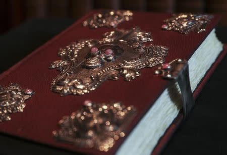 A copy of "The Tales of Beedle the Bard", handwritten and illustrated by Harry Potter author JK Rowling, is displayed at Sotheby's auction house in London, Britain December 8, 2016. REUTERS/Eddie Keogh