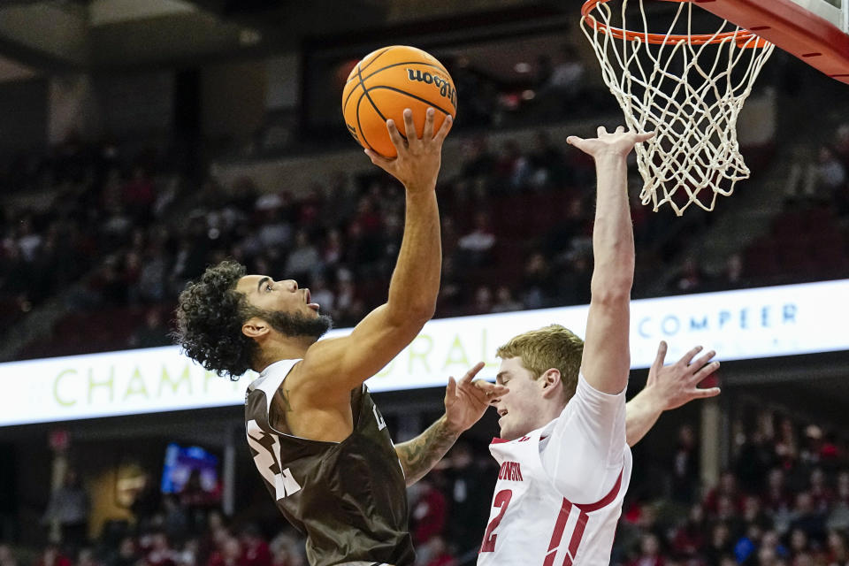 Lehigh's Tyler Whitney-Sidney (22) shoots against Wisconsin's Steven Crowl during the first half of an NCAA college basketball game Thursday, Dec. 15, 2022, in Madison, Wis. (AP Photo/Andy Manis)